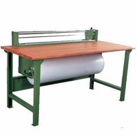 Packaging table with universal cutting attachment and roll holder.(P100)